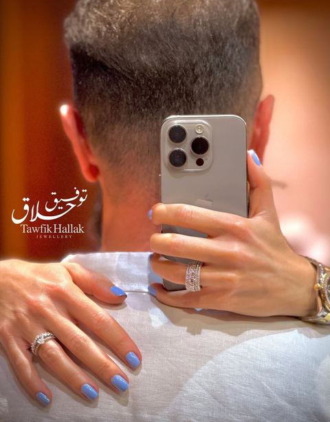 Photo shared by Tawfik Hallak Jewelry on August 17, 2026 tagging @tawfik_hallak_jewelry. May be an image of one or more people, fingernails, ring, phone and text.